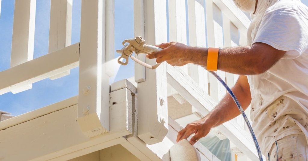 Professional exterior house painting in Fremont using spray and roller application